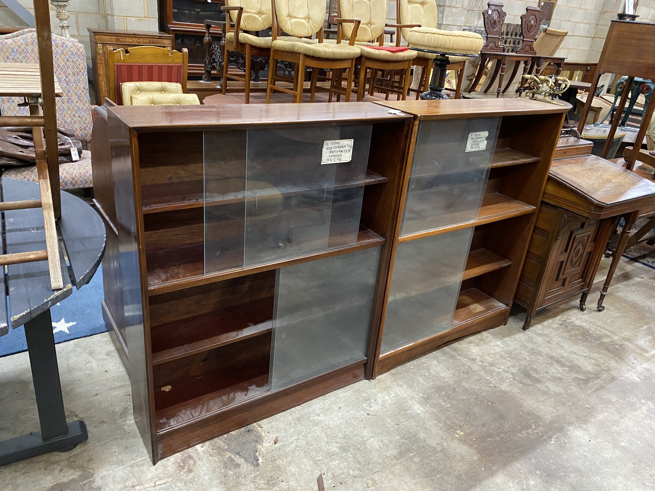 A near pair of mid century bookcases by Herbert E Gibbs, larger width 91cm, depth 24cm, height 112cm